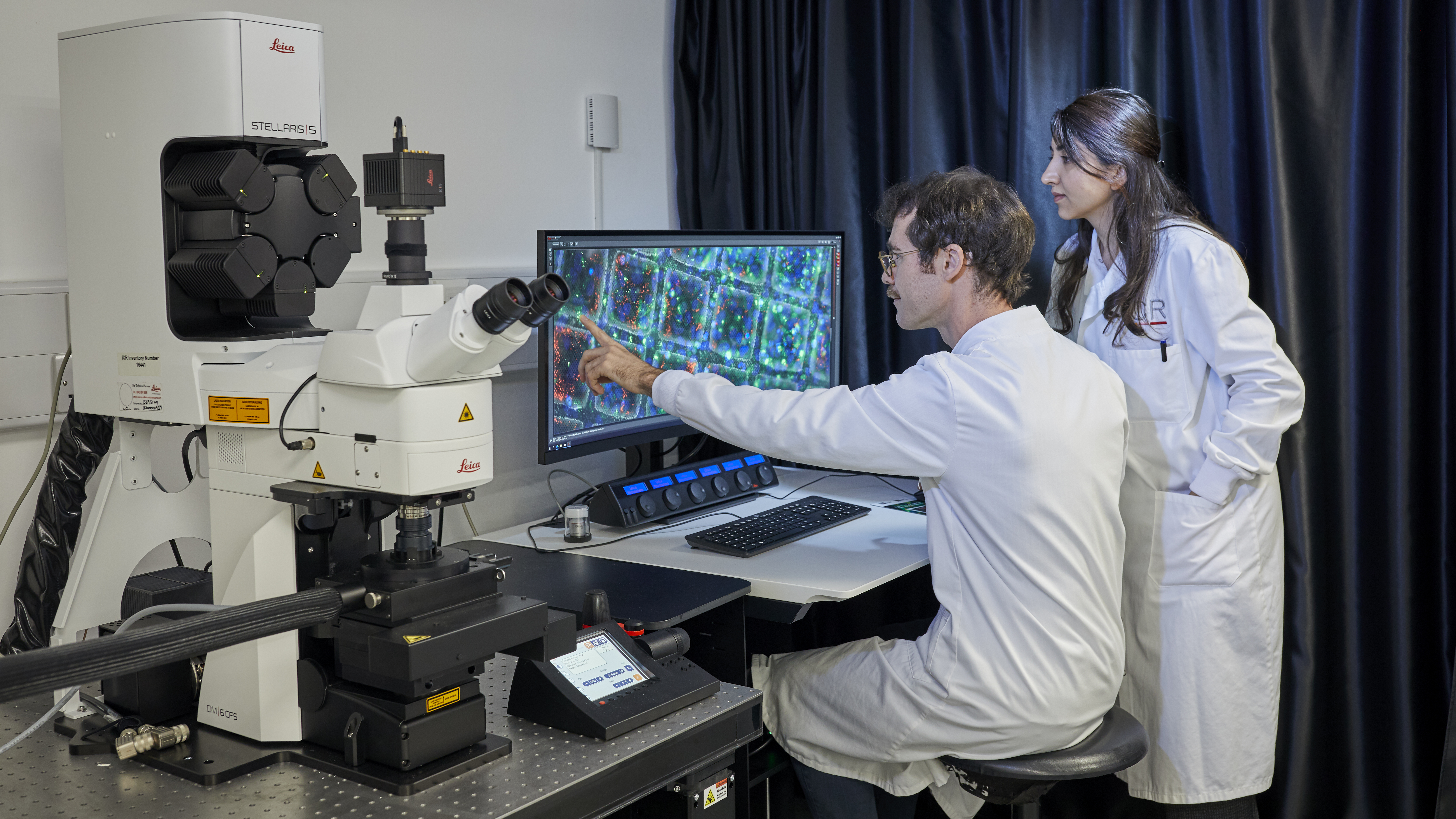 Correlative Light and Electron Microscopy (CLEM) Lab, scientists sat at a monitor looking at cells