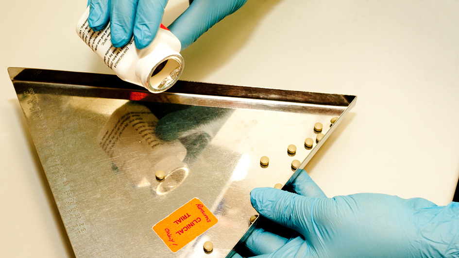 Hands dispensing drugs