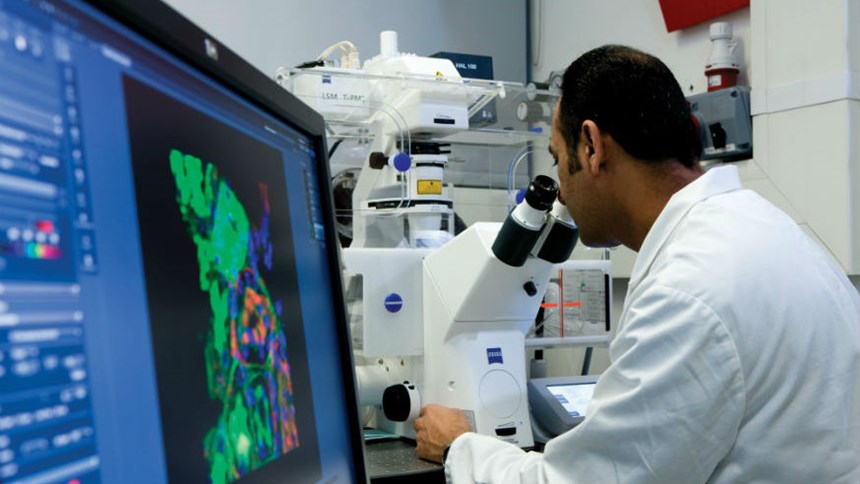 Scientist with computer and microscope 860x484 students-library-teaching-week-4-547-410