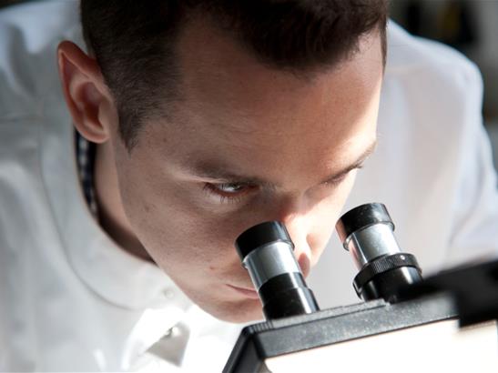 Scientist and microscope content
